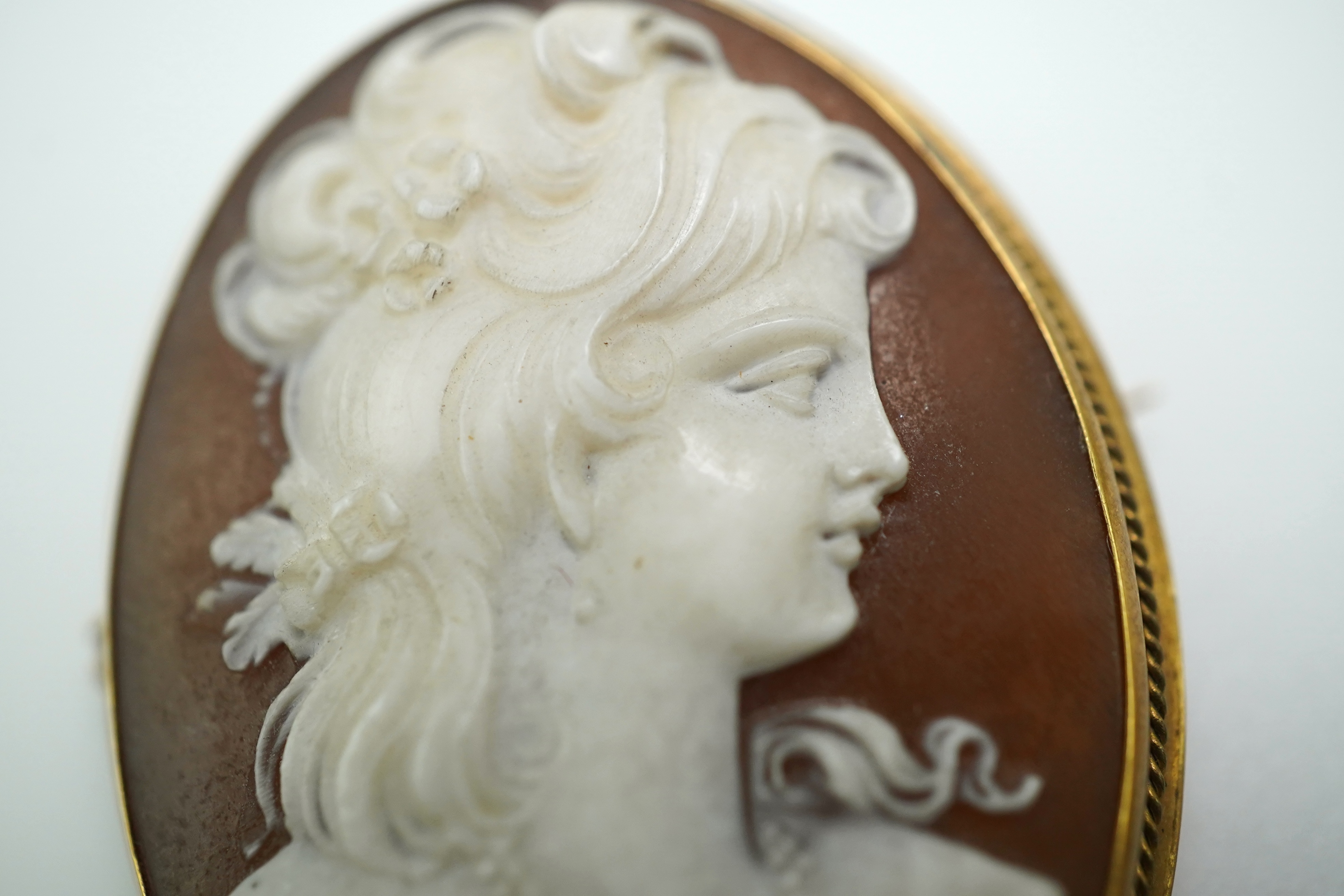 Three shell cameo brooches, 20th century